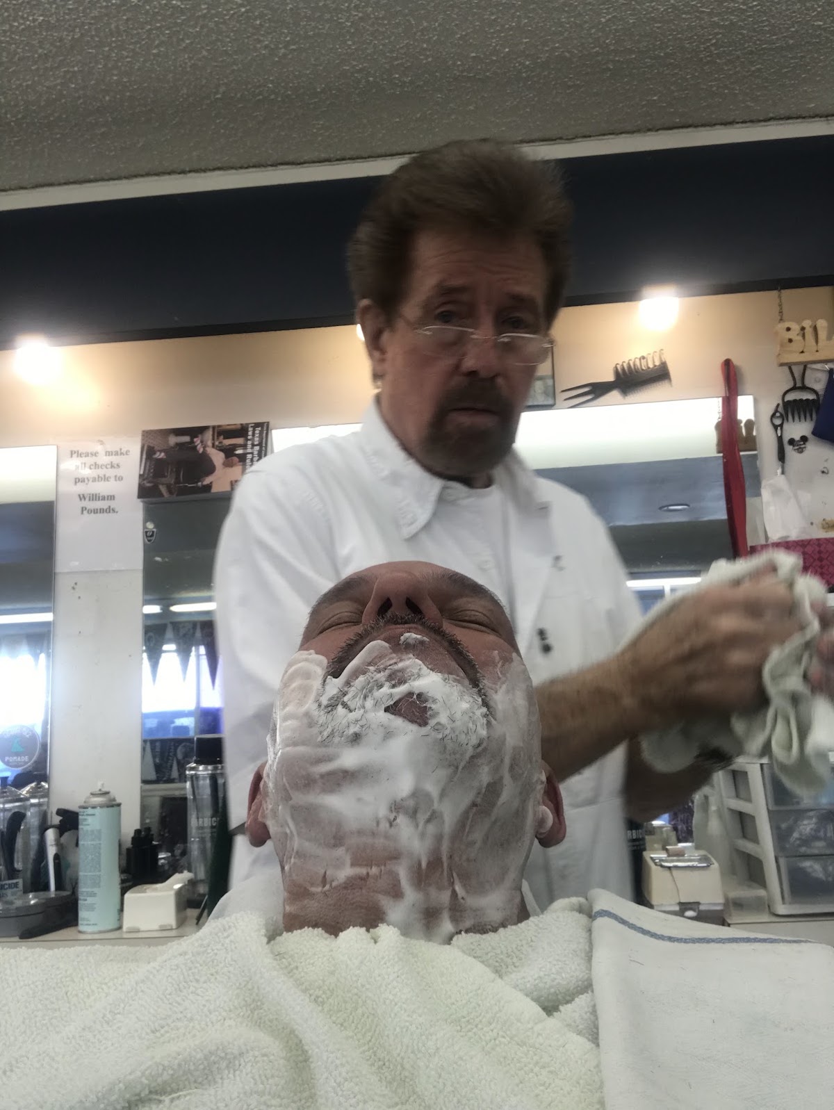 A traditional hot lather shave in progress at Adolph's Barber Shop